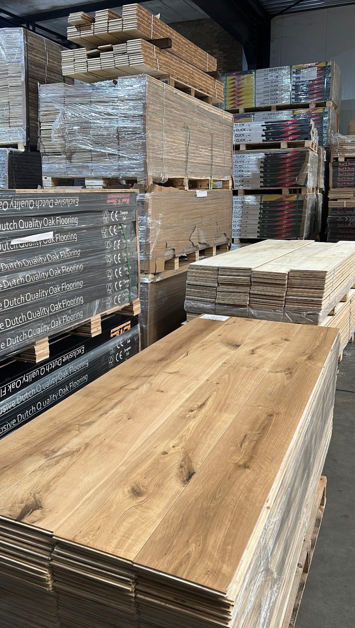 Assortment of discounted and clearance wood flooring, including solid oak, engineered oak, and antique aged floors, ready to install and suitable for residential and commercial interiors