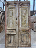 Antique wooden door with hand-carved details