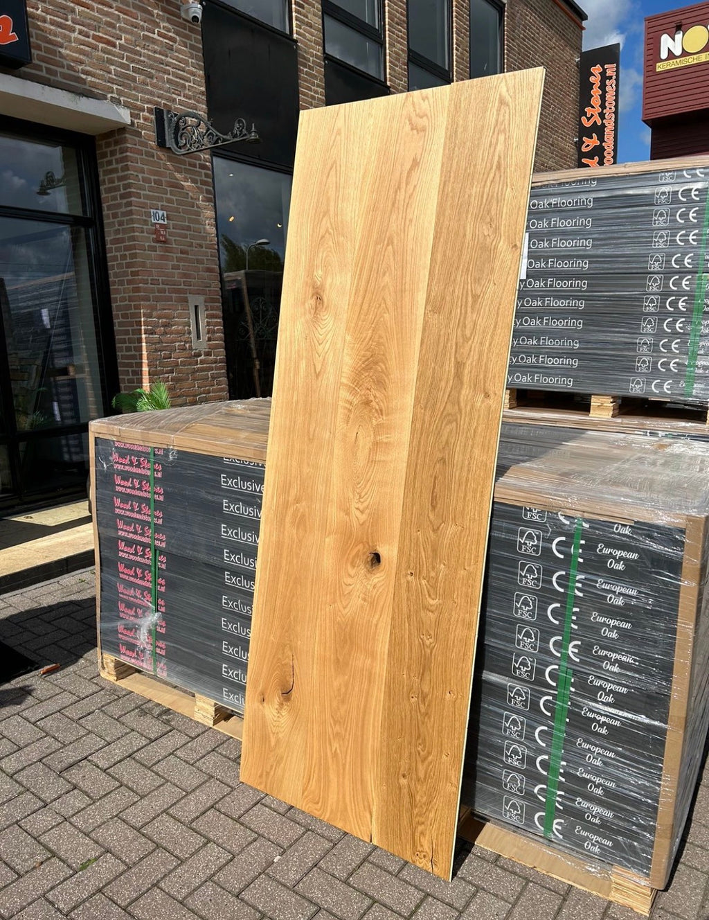 Natural oiled extra wide oak parquet boards showing rich grain, knots, and warm wood tones