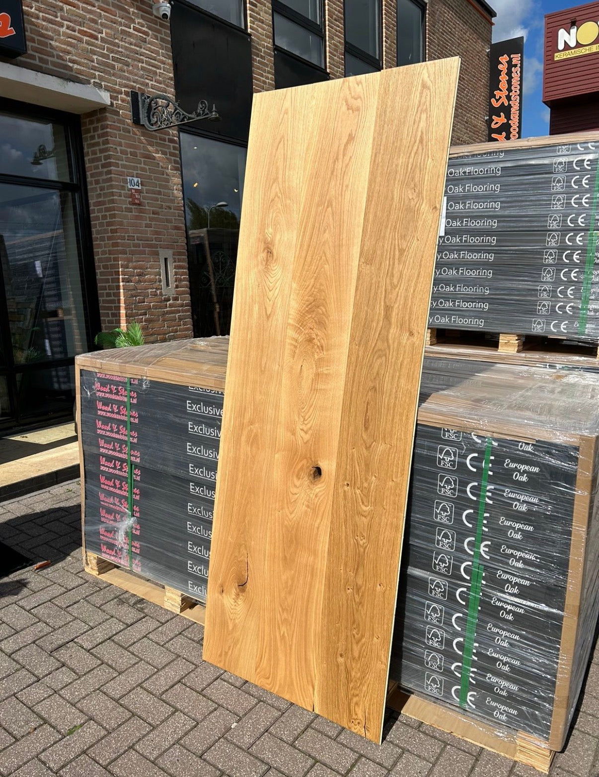 Natural oiled extra wide oak parquet boards showing rich grain, knots, and warm wood tones