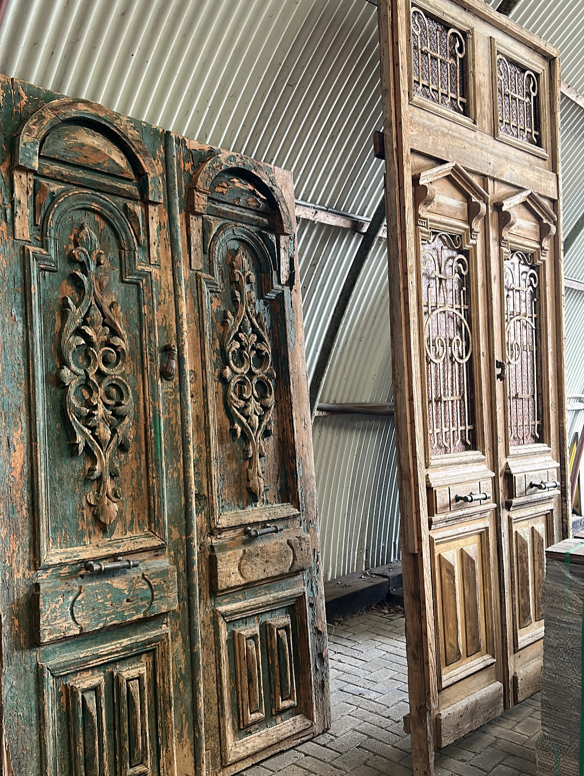 Reclaimed antique double doors with natural wear and timeless character